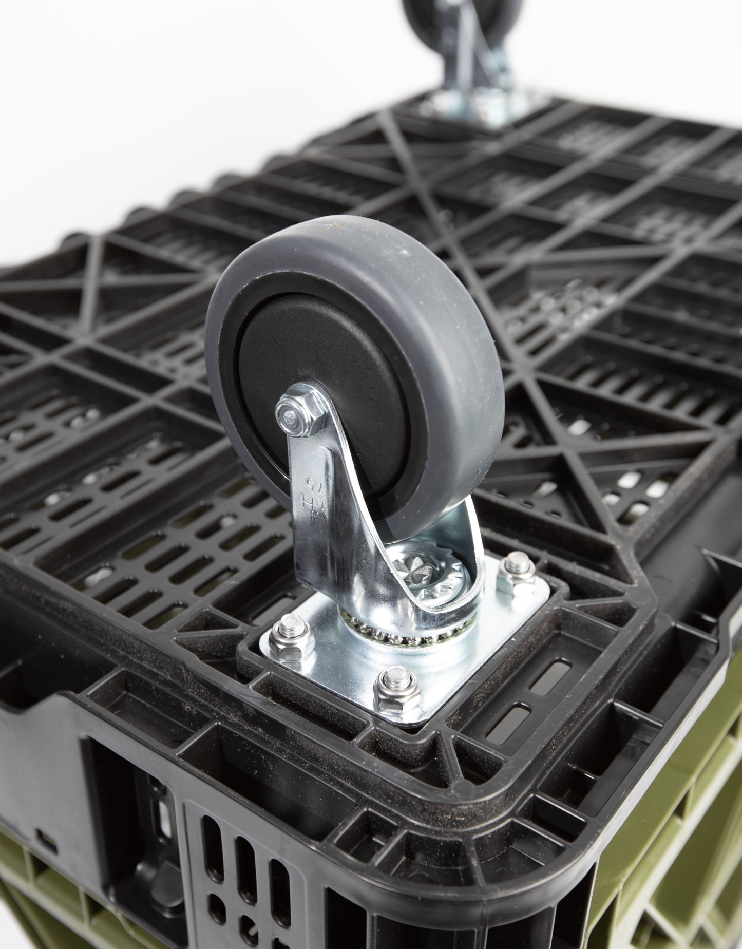 Close-up of swivel caster wheel and included mounting hardware installed on Transformer Crate